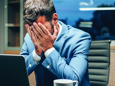 Employee with head in hands