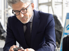 Person using mobile device in airport