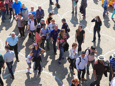 People walking through city