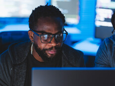 Two men looking at computer screen