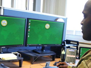.S. Army Staff Sgt. Johnnie Robinson, 2nd Theater Signal Brigade command group noncommissioned officer, uses a government computer with Microsoft Windows 10 operating system, Oct. 2, 2017 in Wiesbaden, Germany.