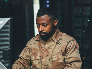 Soldier working on computer