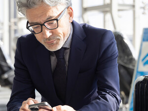 Person using mobile device in airport