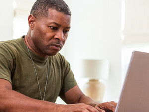 Person using computer at home