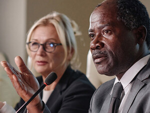 People speaking into microphones