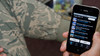 Soldier using a smartphone 