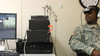 Army Sgt. Lenearo Ashford, Technical Services Branch, Uniformed Services University, undergoes a demonstration of "Virtual Iraq," a life-like simulator that represents a new form of PTSD exposure therapy at Walter Reed Army Medical Center in Washington, D.C., on Sept. 16, 2008.