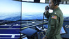 Commander Jason Cassisi, air boss aboard the aircraft carrier USS George H.W. Bush participates in a final prototype demonstration of the Office of Naval Research TechSolutions-sponsored Flight Deck Crew Refresher Training Expansion Packs.