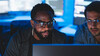 Two men looking at computer screen