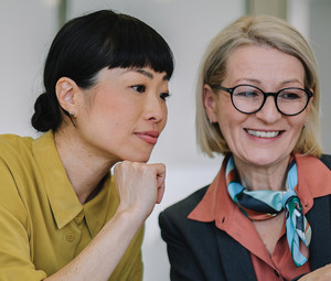 Two coworkers collaborating in the office