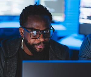 Two men looking at computer screen
